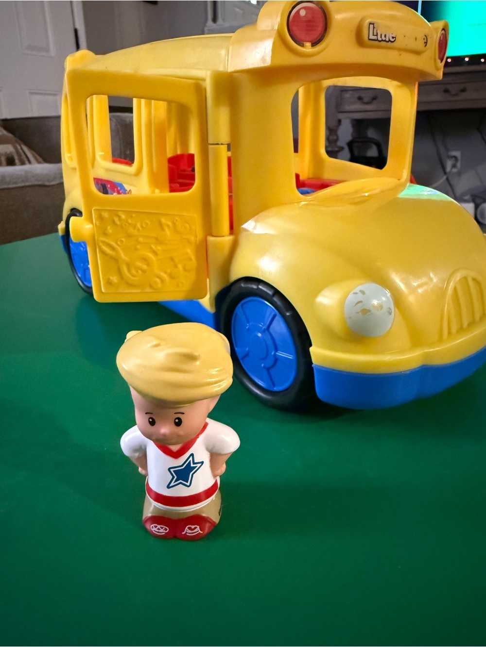 Yellow School Bus Toy with Blue Wheels and Small Figure
